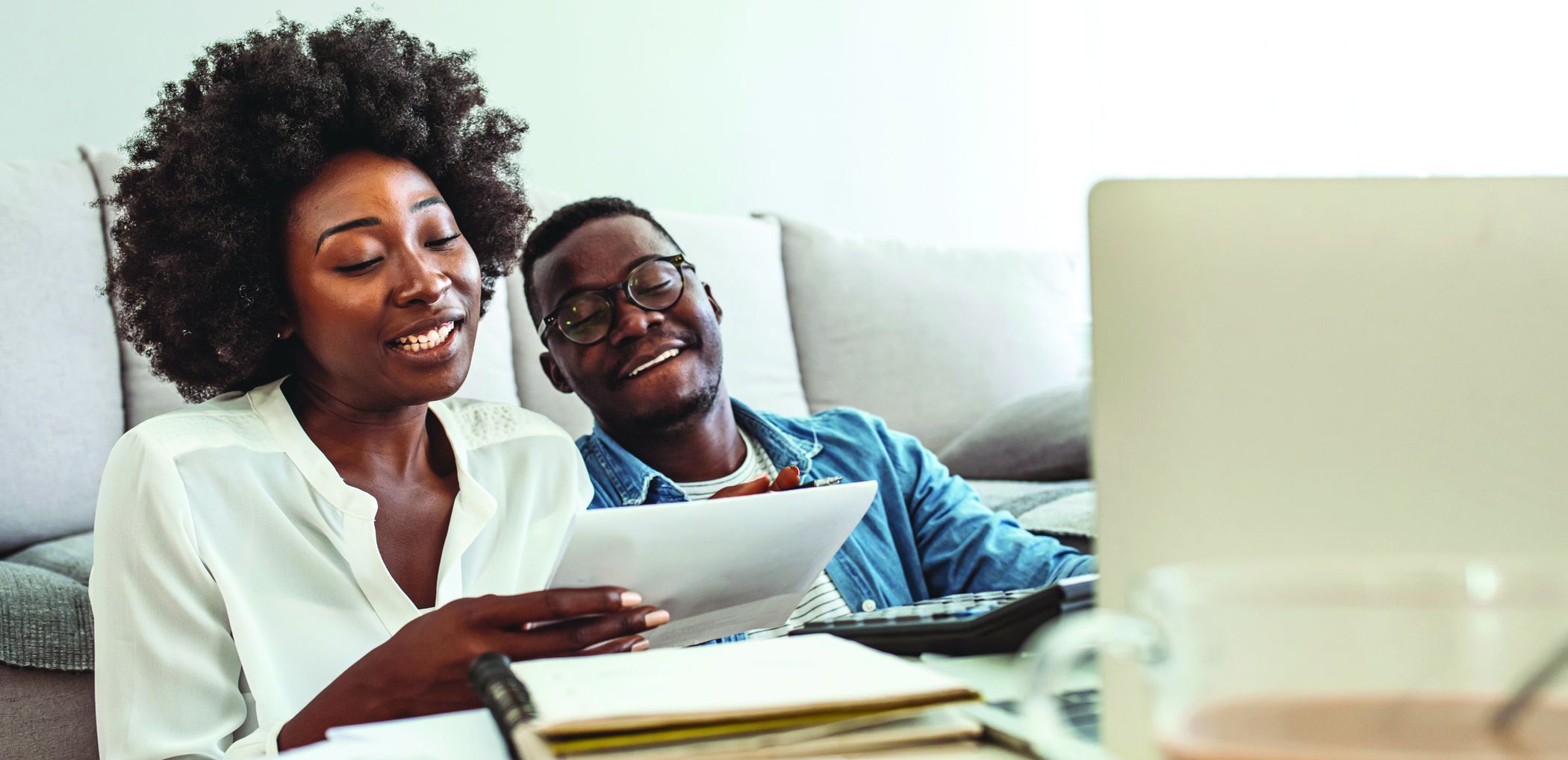 A couple reviews their finances and plans their budget.