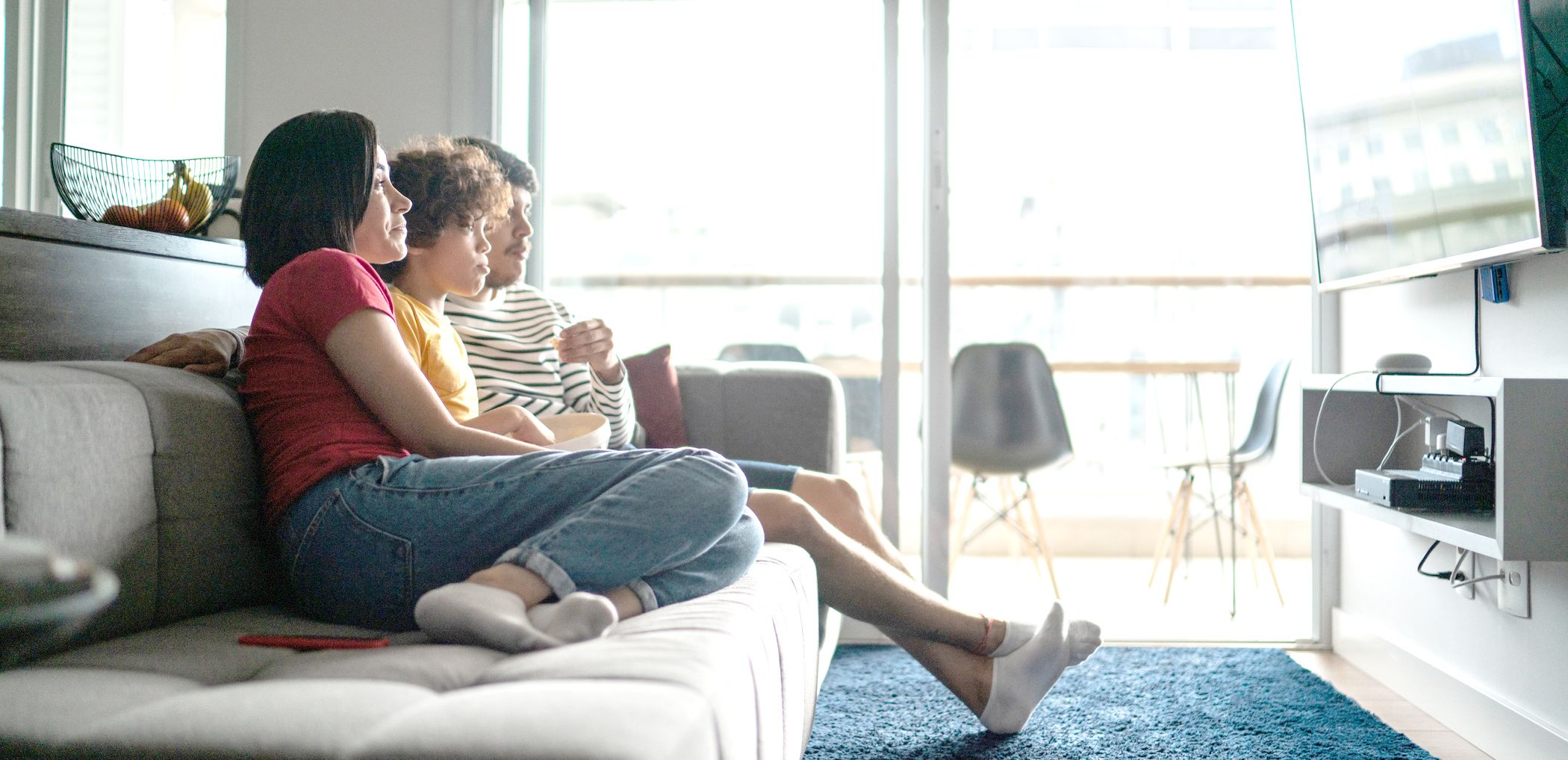 A family watches television at home.