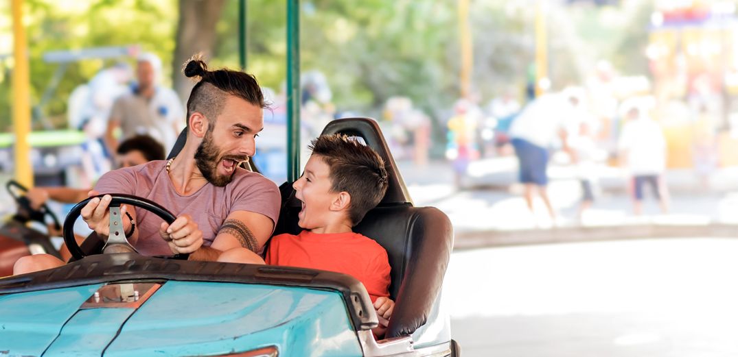 Dad and son at amusement park